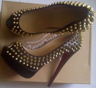  new pair of Christian Louboutin Lady Peep Gold Spike heels on his 