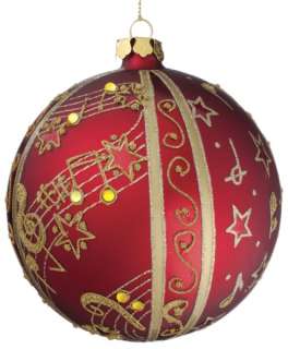 This set of 4 matte red ball ornaments feature gold glitter music 