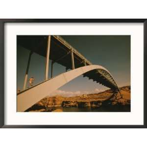  A woman runs up bridge span over the Colorado River near Hite 