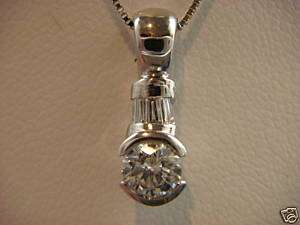 DIAMOND PENDANT ROUND AND BAGUETTE 0.35 CT. EXCLUSIVE.  