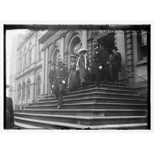  Suffragettes,preceded by policemen,decend steps of City 
