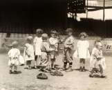 1910 kids playing baseball at a major league stadium  