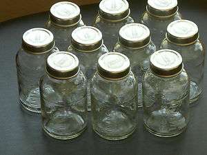 Ten 6 oz Glass bottles with metallic lids  