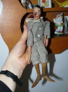 Hand carved antique marionette Pinocchio written on shoes  