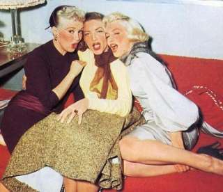    Betty Grable, Lauren Bacall, Marilyn Monroe. (photographer unknown